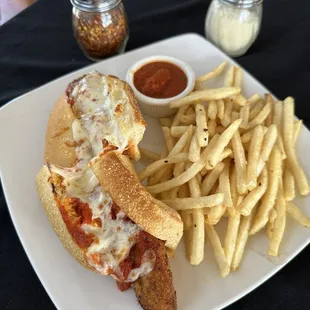 Chicken Parm sandwich and French fries.