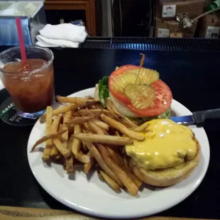 Cheeseburger and fries with bloody mary