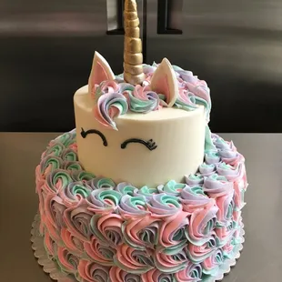 a cake with a unicorn's horn on top