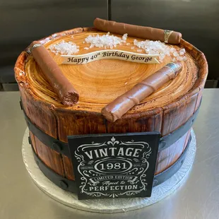 a birthday cake with a cigar