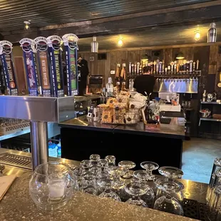  a bar with a lot of glasses on it