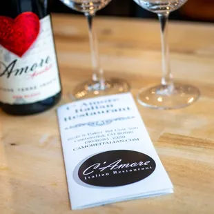 wo wine glasses and a menu