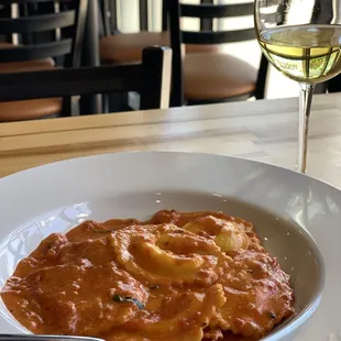 Cheese ravioli in creamy tomato sauce