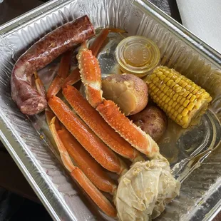 crab legs, potatoes, corn and sausage