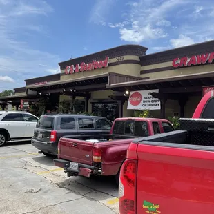 a red truck parked in front of a restaurant