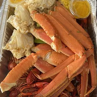 Snow crabs, crawfish, corn, and potatoes.