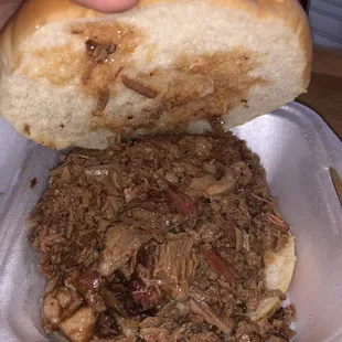  pulled pork sandwich in a styrofoam container