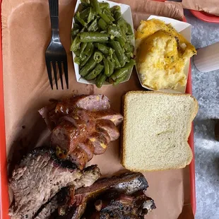 ribs, green beans, mashed potatoes, and bread