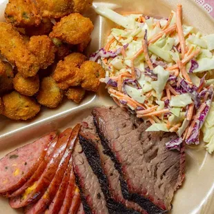 Brisket and sausage plate with fried okra and cole slaw.