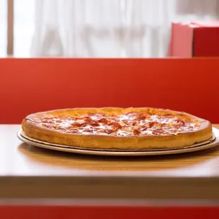 a pizza on a plate on a table