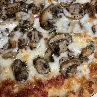 Homemade marinated mushrooms on a pizza. Add it to your steak or chicken subs. Super delicious!