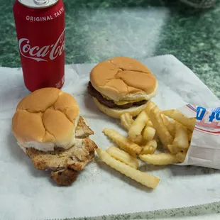 Pork tenderloin sandwich with plain cheeseburger and fries