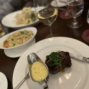 8oz filet with bearnaise sauce and lobster risotto  Sea bass with whipped potatoes  Glass of Chardonnay