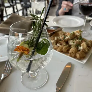 Gin and Tonic came with a flower and rosemary twig