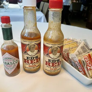 3 levels of Hot sauce and crackers for oysters.