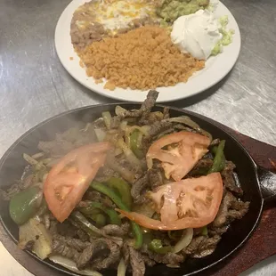 STEAK fajitas with rice and beans guacamole &amp; sour cream