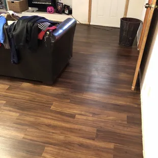 a living room with hardwood floors