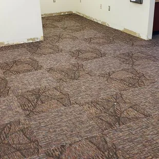 Making a pattern from three different carpet tiles.