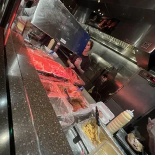 a man preparing food in a kitchen