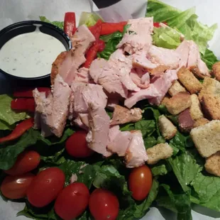 Big salad...topped with smoked turkey or brisket.