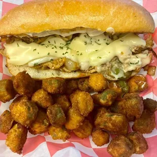 a sandwich with cheese and fried tater tots