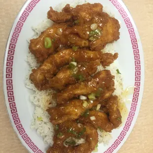 Tiger breast on top of white rice spicy or regular flavor come try it you will love it