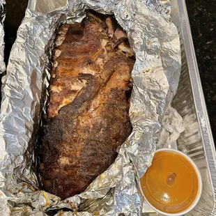 Slab of ribs with seasoning and sauce