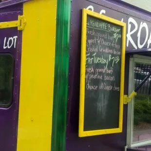 a purple and yellow food truck
