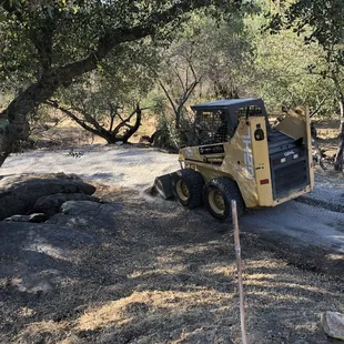a construction vehicle on a dirt road