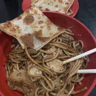 Noodles with chicken, carrots, and tofu! I use the teriyaki sauce but add a scoop of garlic. Along with Sesame Bread!