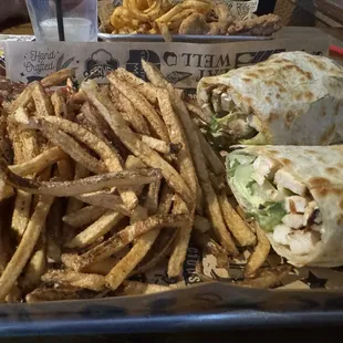 Grilled chicken Caesar wrap. House cut fries.