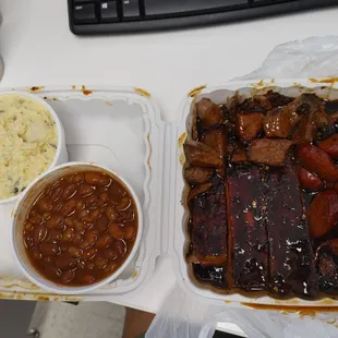 3 way ribs with more under, brisket, hit links. Potato salad and bakes beans. Good sizing!