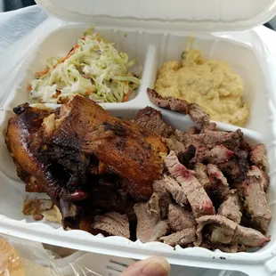 This is a two-way chicken and brisket with coleslaw and potato salad. It was tasty!