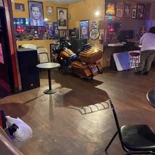 Motorcycle parked inside the bar.