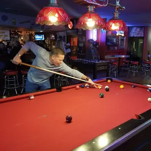 a man playing pool