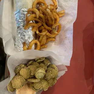 Fried pickles, curly fries, and veggie wrap