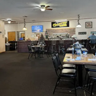 Inside of restaurant, counter and tables.