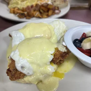 chicken benedict with a fruit cup