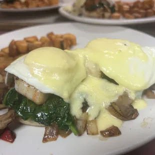 loaded shrimp benedict, English muffin topped with eggs, grilled Cajun shrimp, onions,
Peppers, spinach, and mushrooms