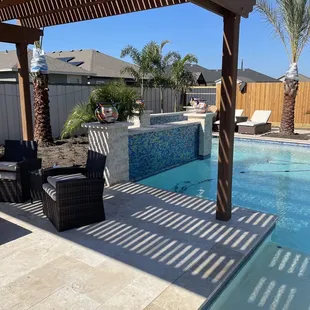 Pergola area looking out over the pool.