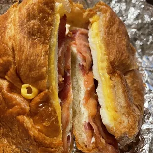 3-10-2022 bacon, egg and cheese croissant sandwich with cream cheese spread.