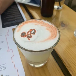 a drink with a drawing on it