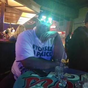 Me with my birthday light up glasses enjoying myself  and drinking of course