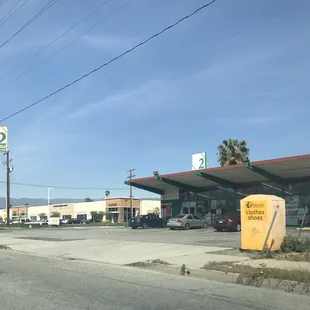 a view of a gas station from across the street