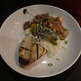 Chef's Special Shrimp, Grilled Andouille Sausage, Pork Tenderloin Etouffee, Basmati Rice, Garlic Oil, Grilled Baguette