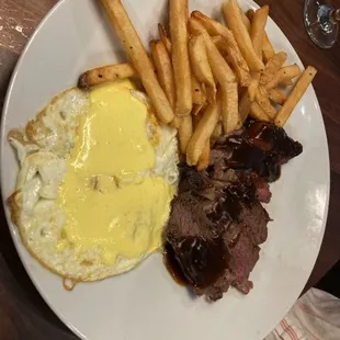 Supposedly over easy eggs and medium steak