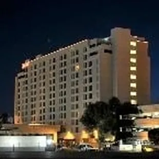 the exterior of a hotel at night