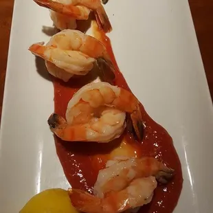 a plate of shrimp and avocado
