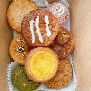 Top: Guava mochi, Portugese egg tart Bottom: Cassava muffin, taro ball, mochi, banana walnut mochi, matcha choux, black sesame choux