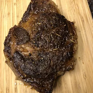 Prime cut Rib Eye cooked on an iron skillet with sea salt, pepper, rosemary, grass fed butter, and olive oil.